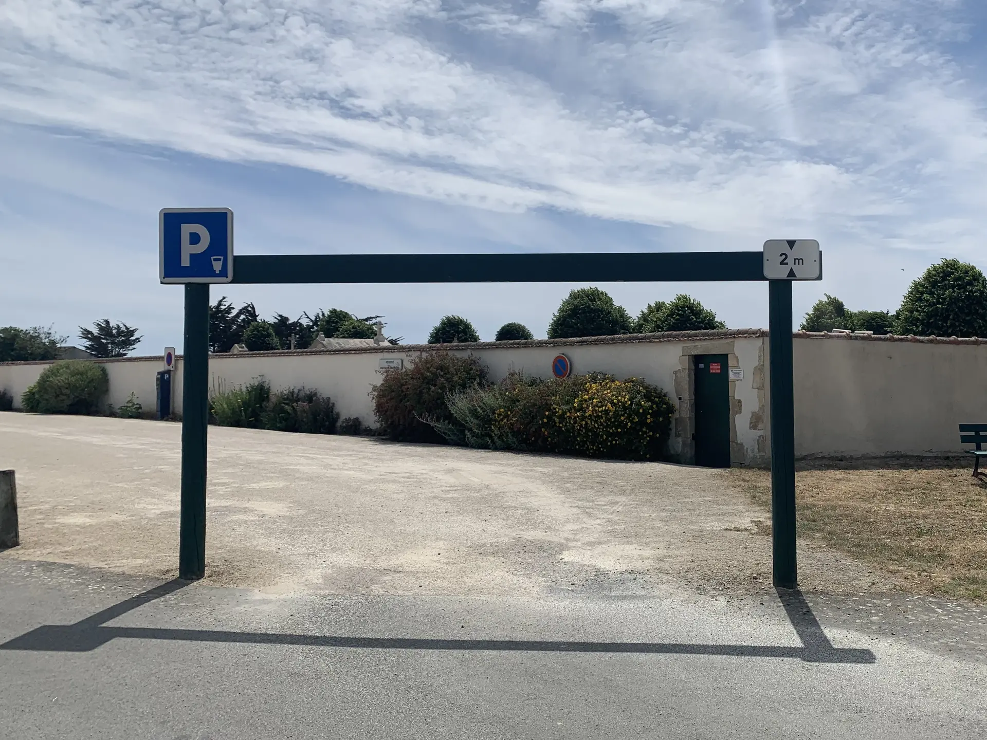 Parking entrance with high barrier