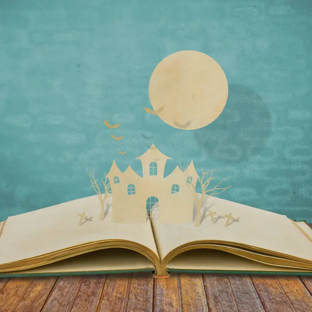 Paper cut of halloween on old book