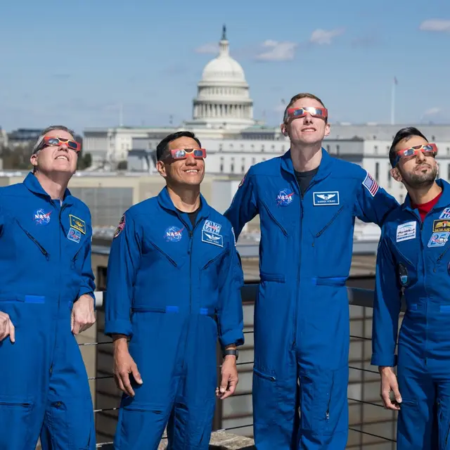 Expedition 69 Crew Wears Solar Eclipse Glasses
