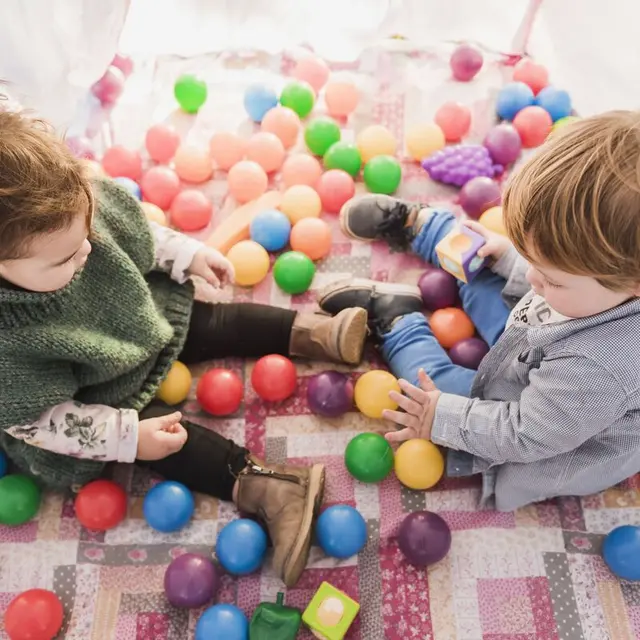 high-angle-view-kids-sitting-inside-tepee