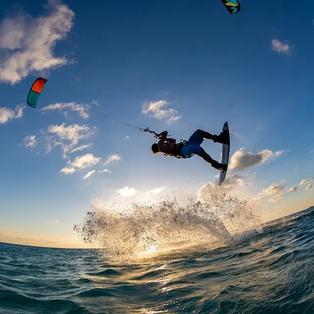 person-surfing-and-flying-parachute-at-the-same-time-in-kitesurfing-bonaire-caribbean