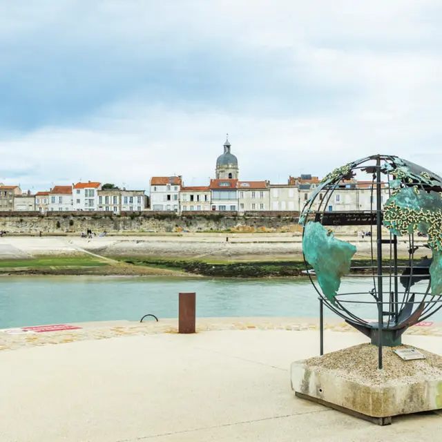 Globe of La Francophonie and the Lantern Tower on Saint Jean d'Acre Square in the Old Port of La Rochelle, France