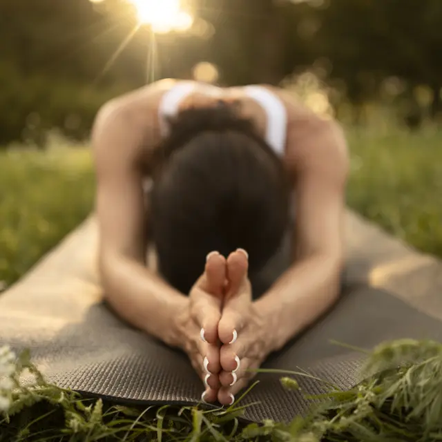 full-shot-woman-stretching-mat
