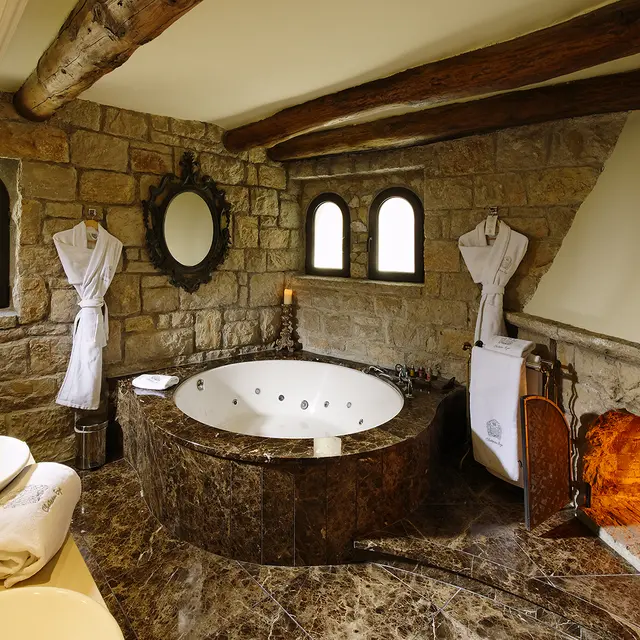 Chateau eza Jacuzzi bath with fireplace.jpg