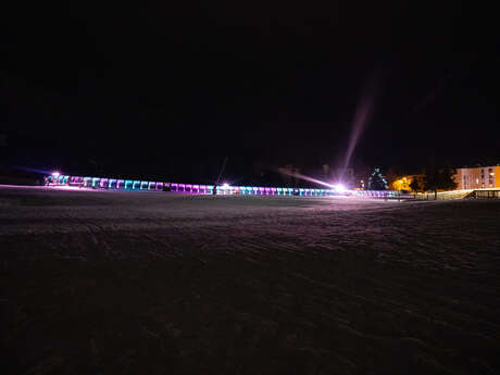 Night skiing and sledging on the snow front