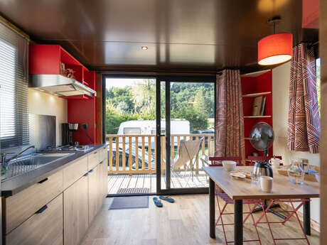 Wooden caravans at Camping Huttopia Divonne